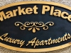 604  recessed wood carving name sign for apartment complex